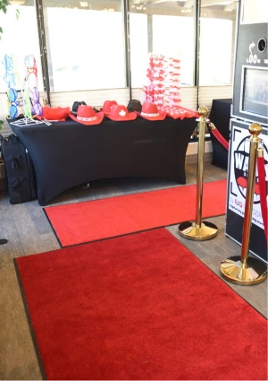 Red carpet under product stand in showroom