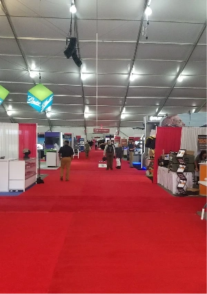 Red exhibition carpet between expo stalls