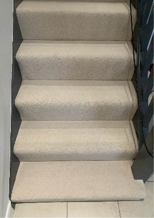 Hard-wearing wool stair carpet.